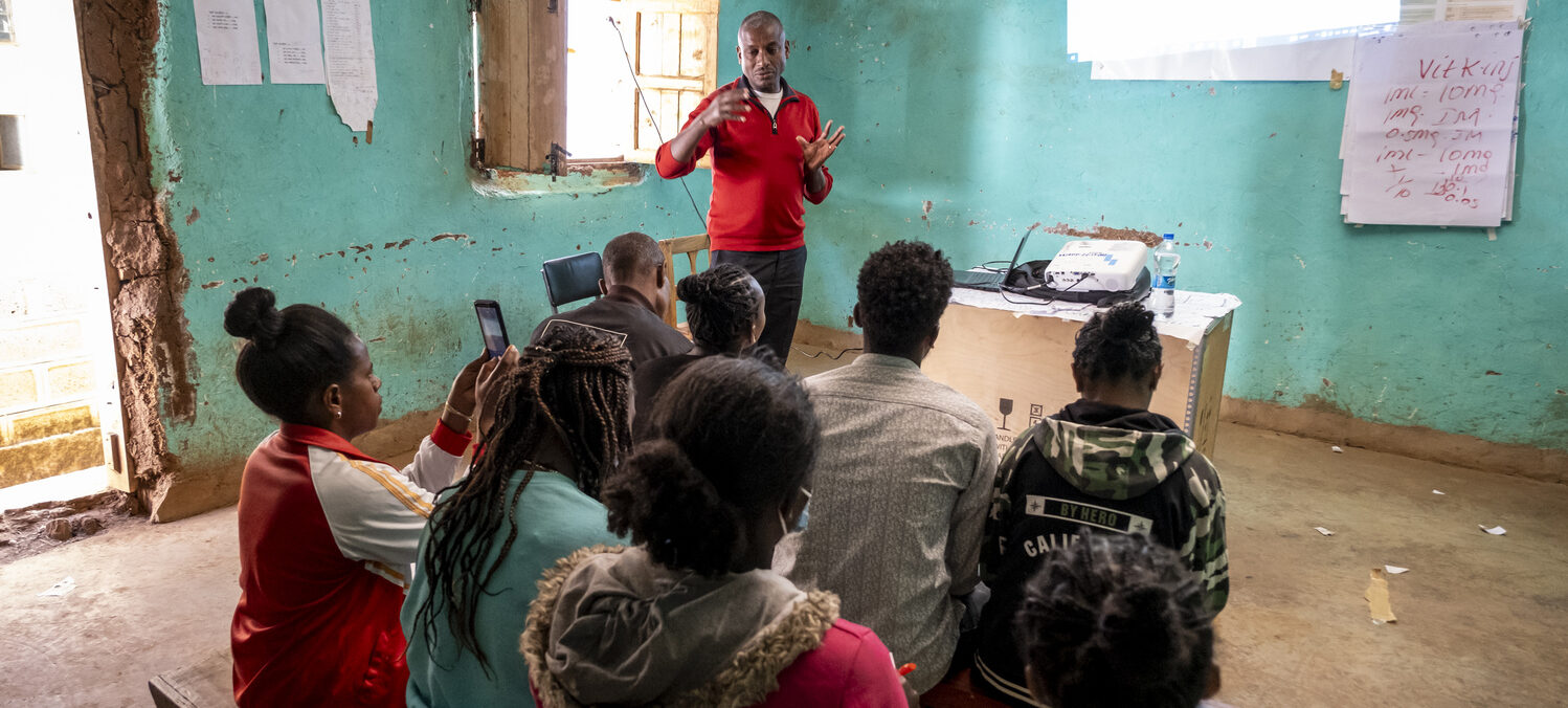 A group of healthcare providers listening to a Health Awareness Event.