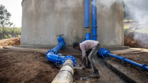 A man working on the water reservoir above Ijaji.