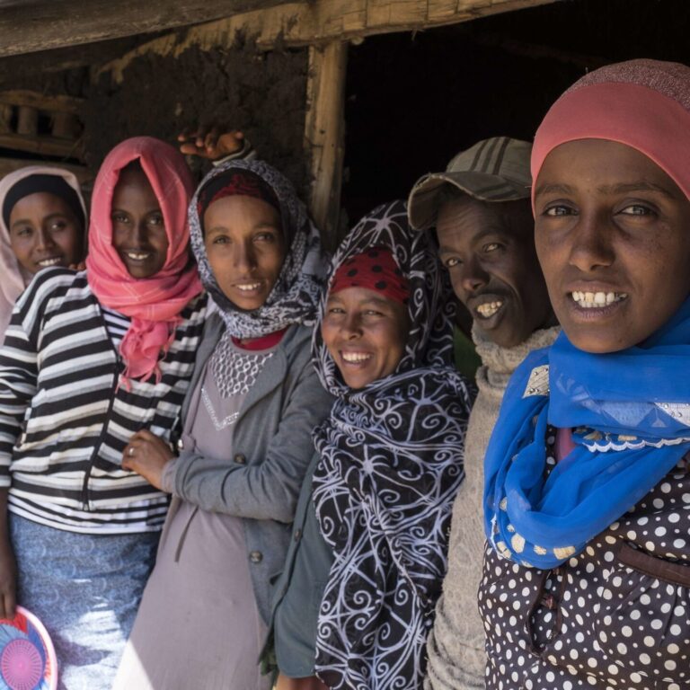 A group of women joined together as a cooperative.