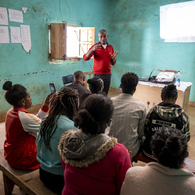 A group of healthcare providers listening to a Health Awareness Event.