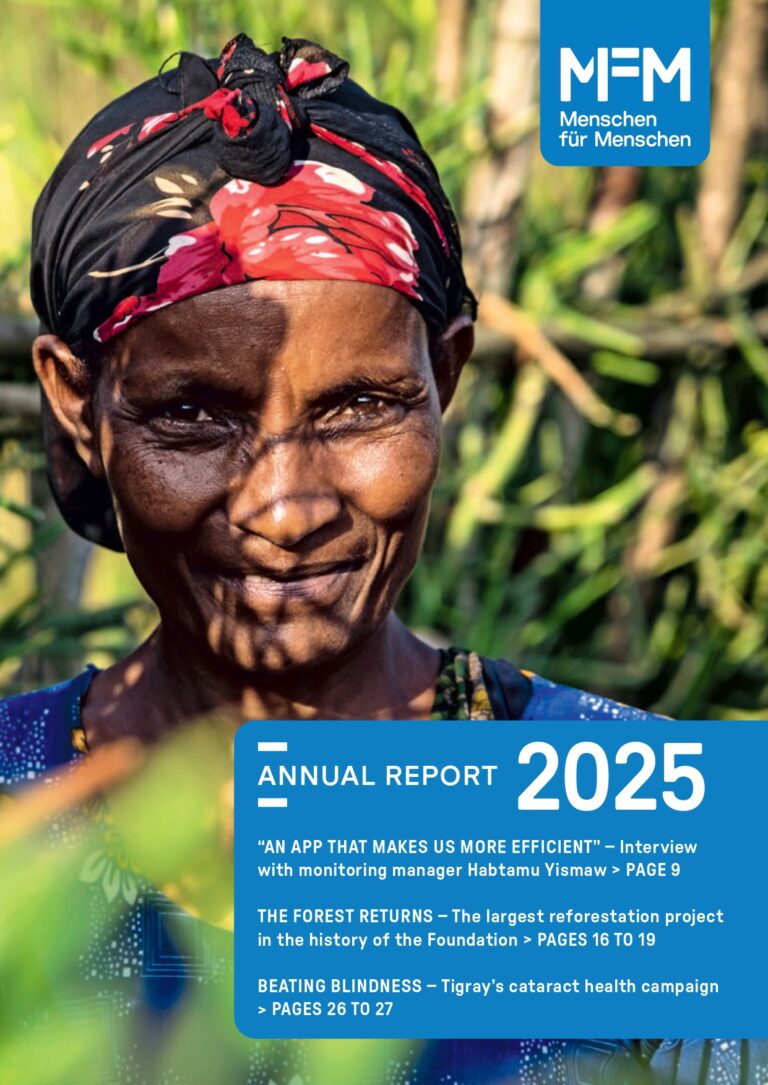 Cover image of the annual report of 2025. A girl smiling towards the camera.